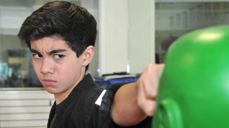 Aidan Considine, 13, shows off his martial arts expertise at...