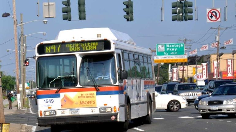 An N47 Long Island Bus turns onto Hempstead Turnpike in...