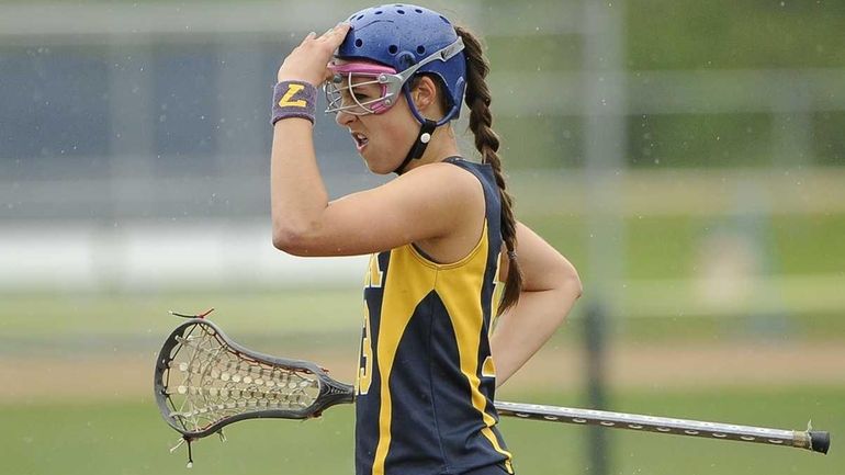 Shoreham-Wading River midfielder Alex Fehmel watches game action against Huntington...