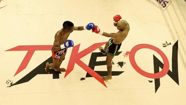 Rudy Felix, left, fights Cornel Ward, right , in a...