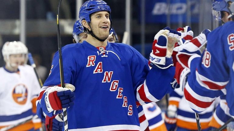 Dan Girardi celebrates his first period goal against the Islanders....