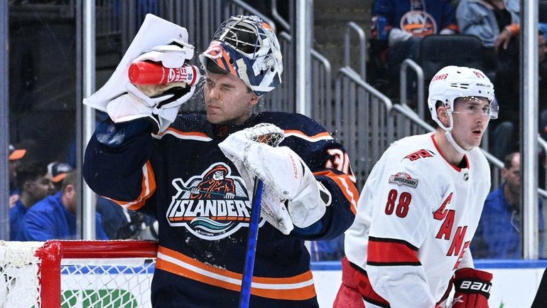 Islanders goaltender Ilya Sorokin reacts after a goal by Carolina...