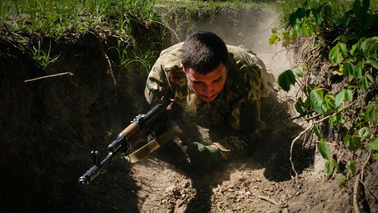 A newly recruited soldier of the 3rd assault brigade trains,...