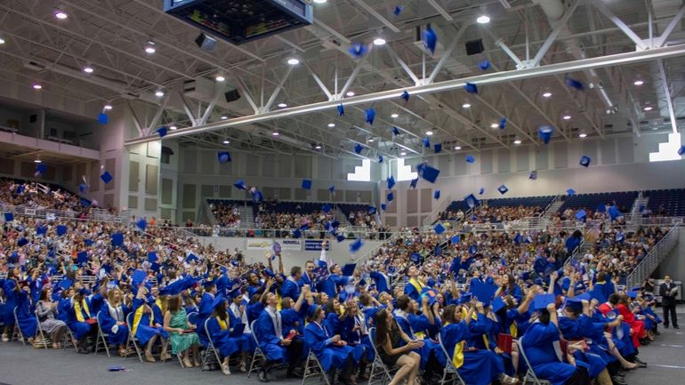 Gen. Douglas MacArthur High School graduates celebrate as the commencement...