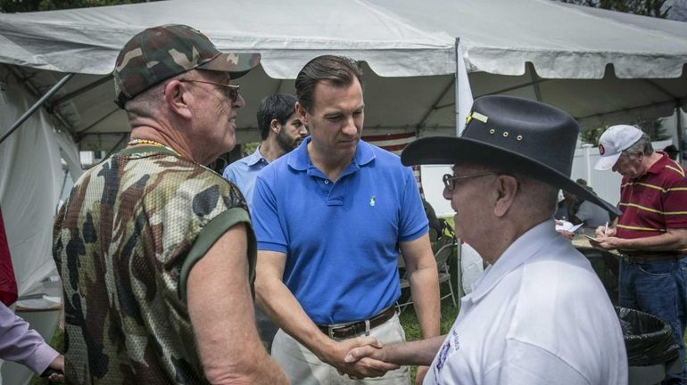 Nassau County Executive Candidate Tom Suozzi campaigns at a barbecue...