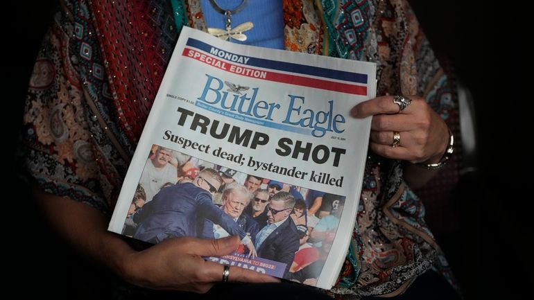 Donna Sybert, Managing Editor of the Butler Eagle newspaper, holds...