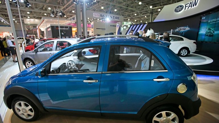 Chinese FAW V2 car is displayed at the Moscow International...