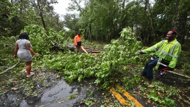 Residents of an apartment complex try to clear Old St....