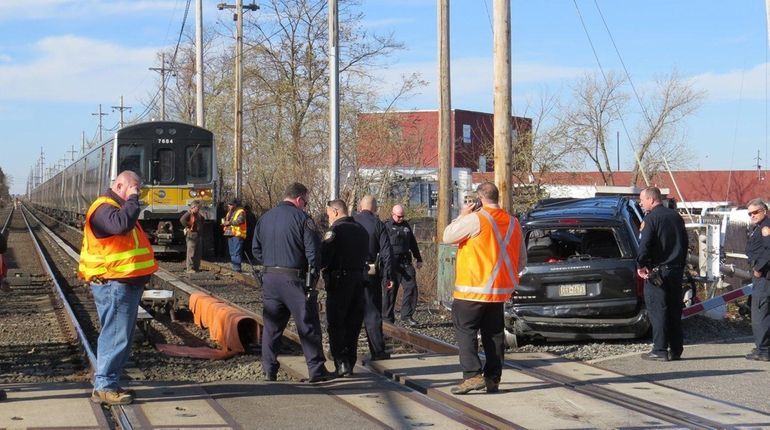 Police investigate at New South Road in Hicksville, where an...