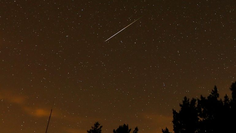 In this long exposure photo, a streak appears in the...