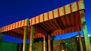 A daybed awaits guests on the outside patio of South...