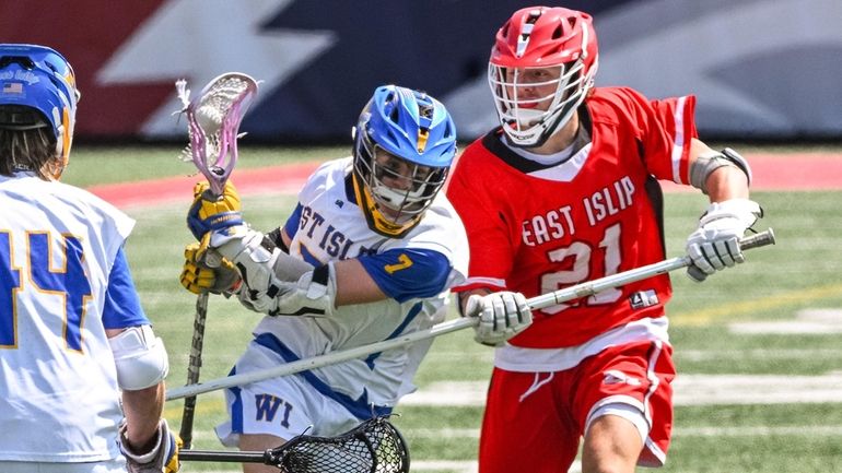 Cole Sparks of West Islip drives through Anthony Affrunti of...