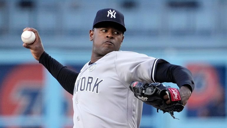 New York Yankees starting pitcher Luis Severino throws to the...