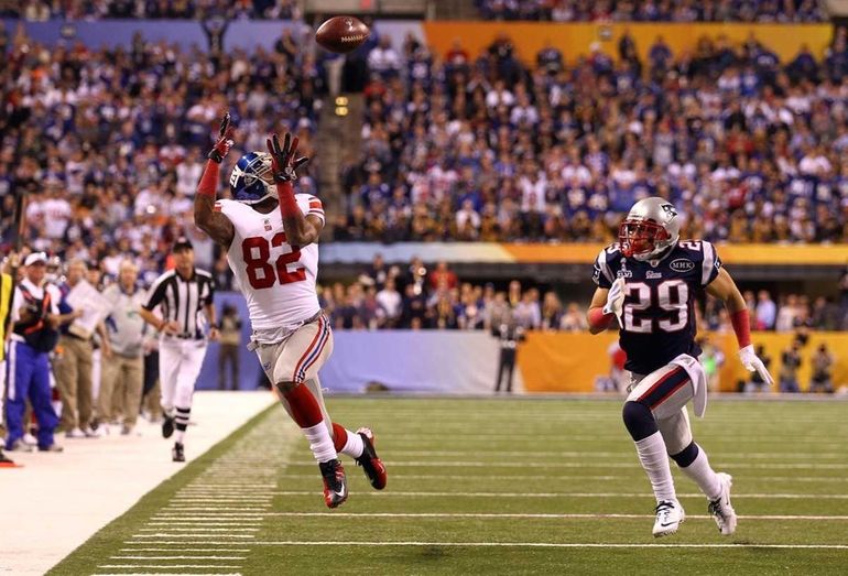 New York Giants - Super Bowl Football New York Giants Victor Cruz (80), and  Hakeem Nicks hoist up the Vince Lombardi Trophy after winning the NFL Super  Bowl XLVI football game against