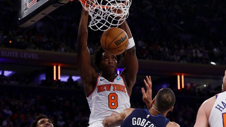 OG Anunoby #8 of the New York Knicks dunks the...