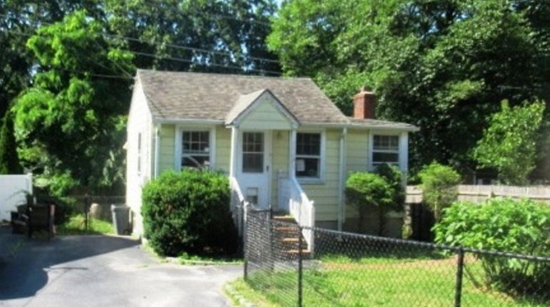 This Rocky Point home, built in 1935, has a semifinished basement...