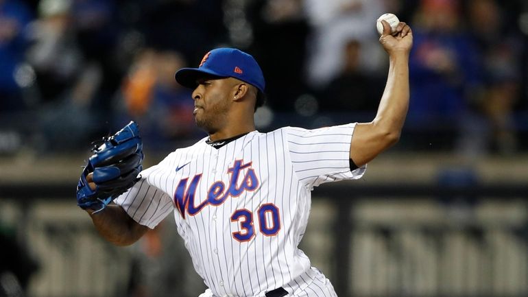 New York Mets relief pitcher Joely Rodriguez (30) throws against...