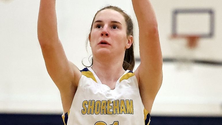 Shoreham-Wading River forward Juliana Mahan takes the foul shot against...