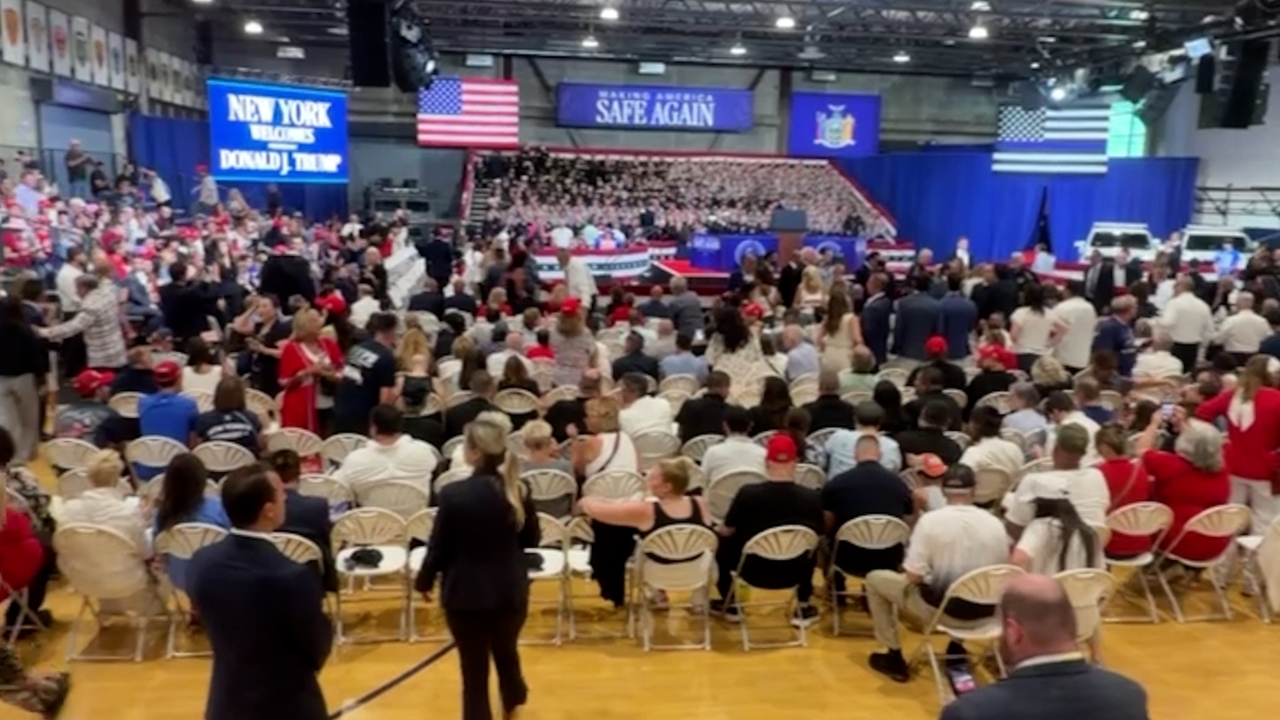 Crowds arrive inside of the Nassau County Police training facility