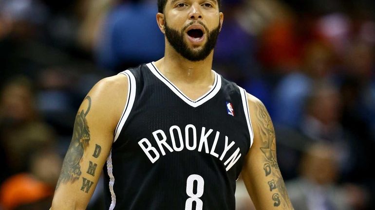 Deron Williams yells to a teammate during a game against...