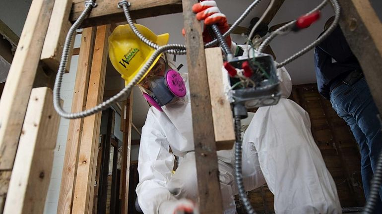 AmeriCorps crew member Jon Luty, a volunteer from the state...