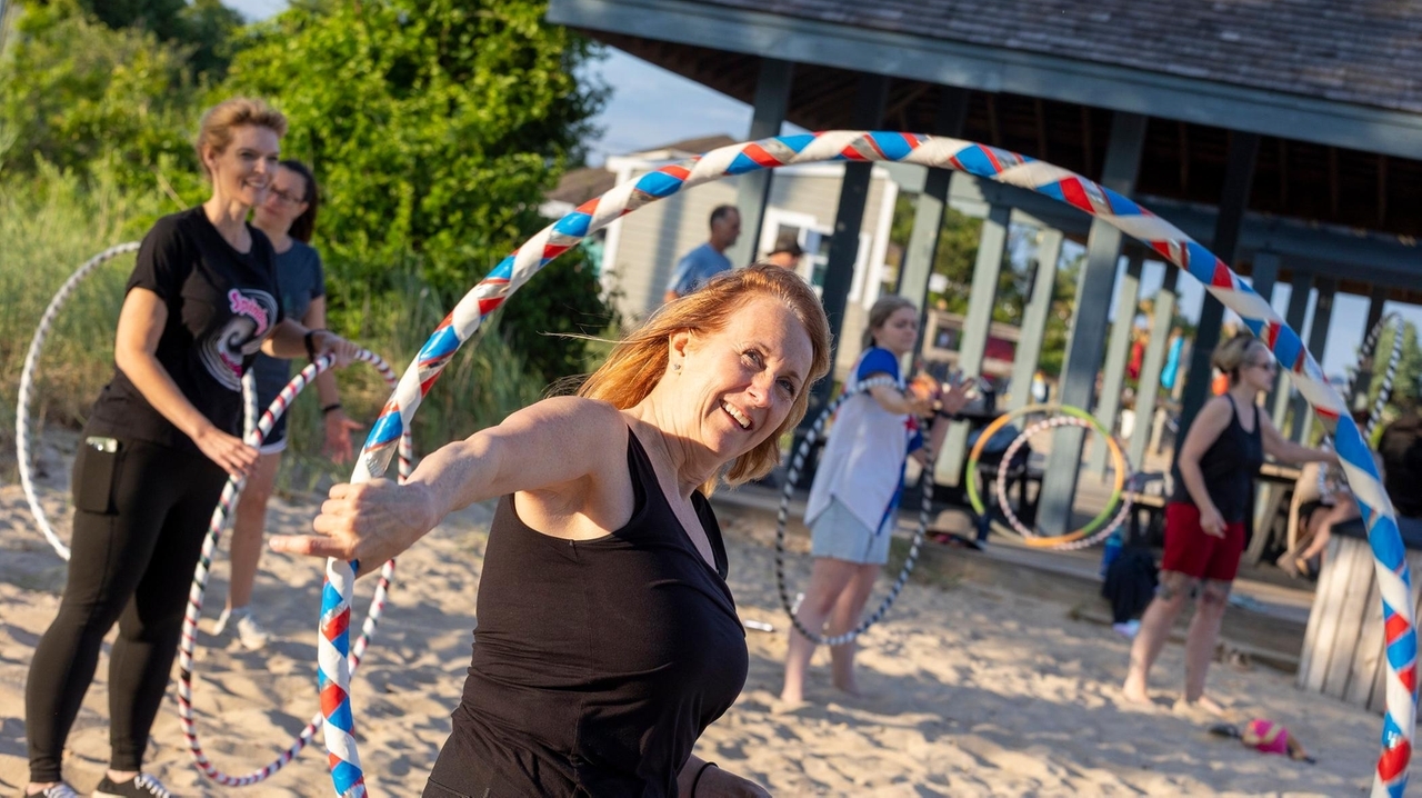 Hula-hooping classes on Corey Beach offer a fun spin on fitness
