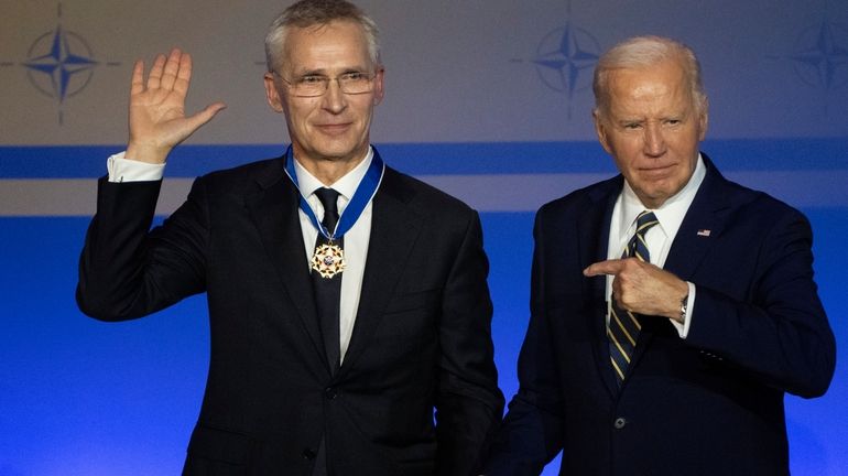 U.S. President Joe Biden points to NATO Secretary-General Jens Stoltenberg...