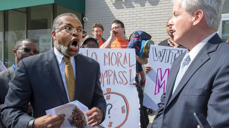 Hempstead attorney and activist Frederick Brewington, left, faces off with...