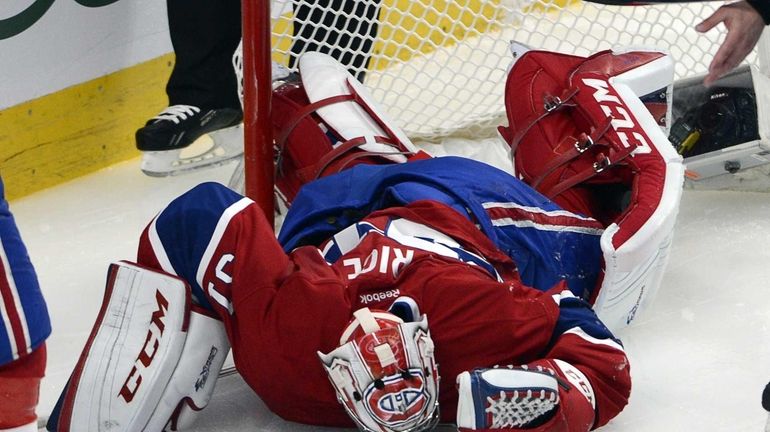 Montreal Canadiens goalie Carey Price (31) lies on the ice...