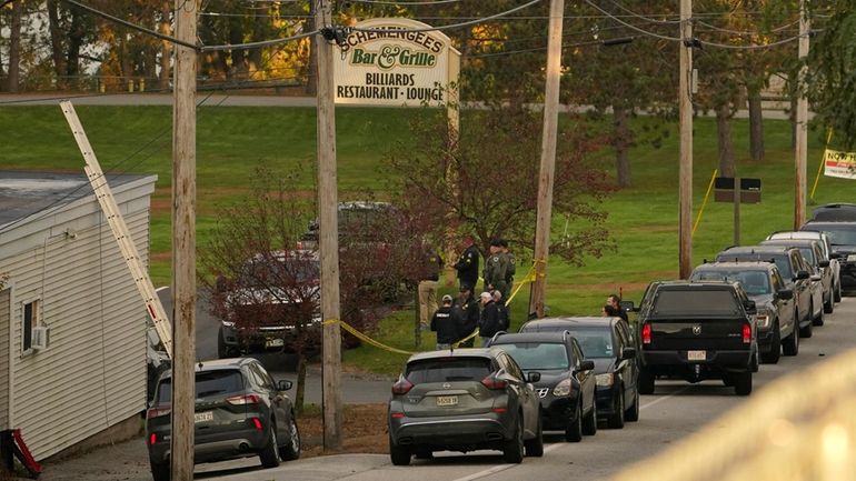 Law enforcement gather outside Schemengee's Bar and Grille, Thursday, Oct....