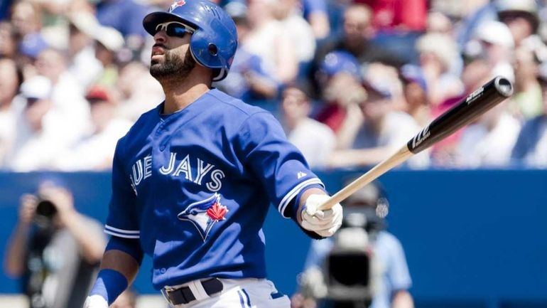 Toronto Blue Jays' Jose Bautista watches the flight of the...