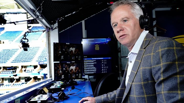 Patrick McEnroe in the booth of ESPN's broadcast suite during...