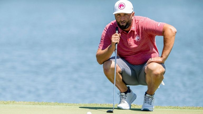 Captain Jon Rahm, of Legion XIII GC, lines up a...