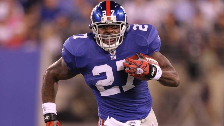 Brandon Jacobs of the New York Giants runs the ball...