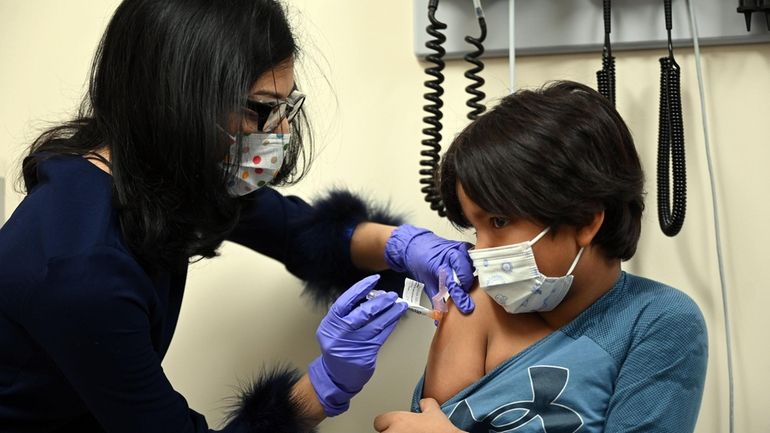 Aadam Hameedi, 5, of Hicksville, gets second dose of the Pfizer...