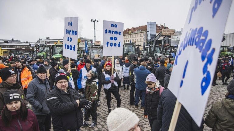 Tractors are parked in market square during "a food march"...