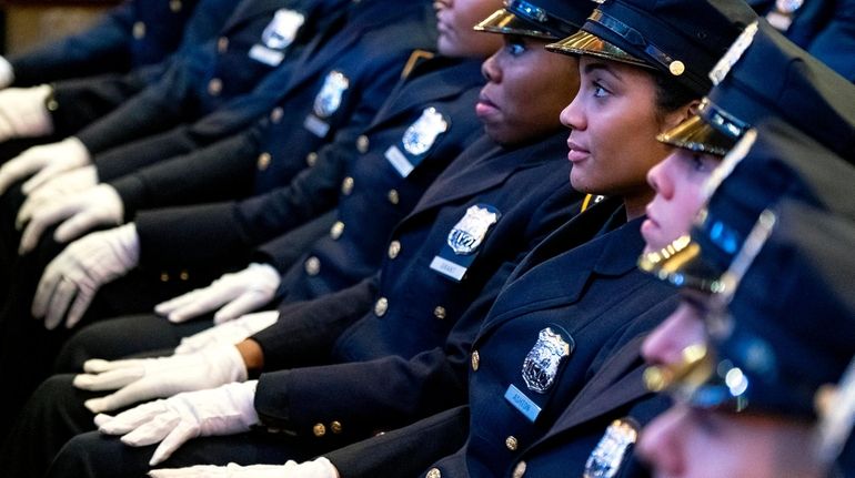 NYPD recruits at their police academy graduation ceremony. The NYPD...