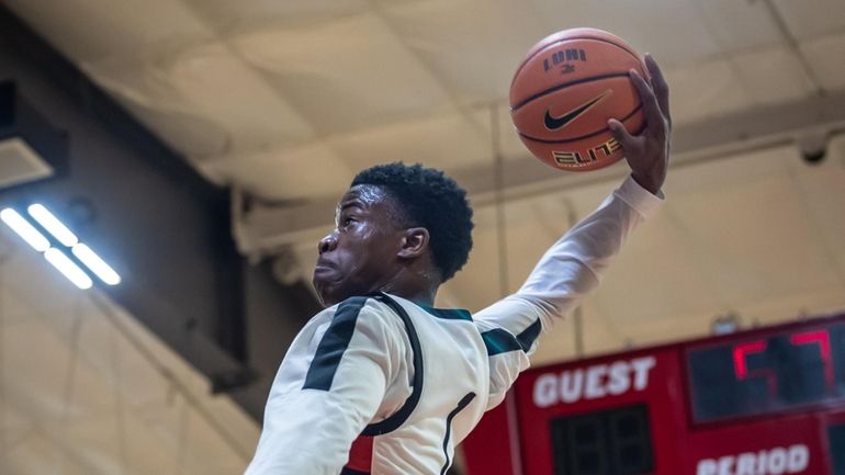 Long Island Lutheran’s.VJ Edgecombe dunking the ball on a fast...