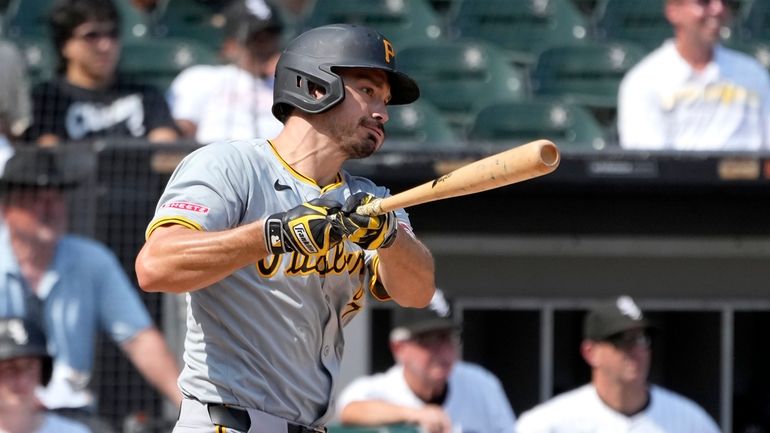 Pittsburgh Pirates' Bryan Reynolds watches his two-run single off Chicago...