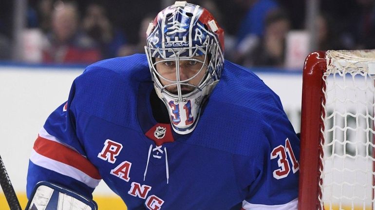 Rangers goalie Ondrej Pavelec keeps his eye on the puck...