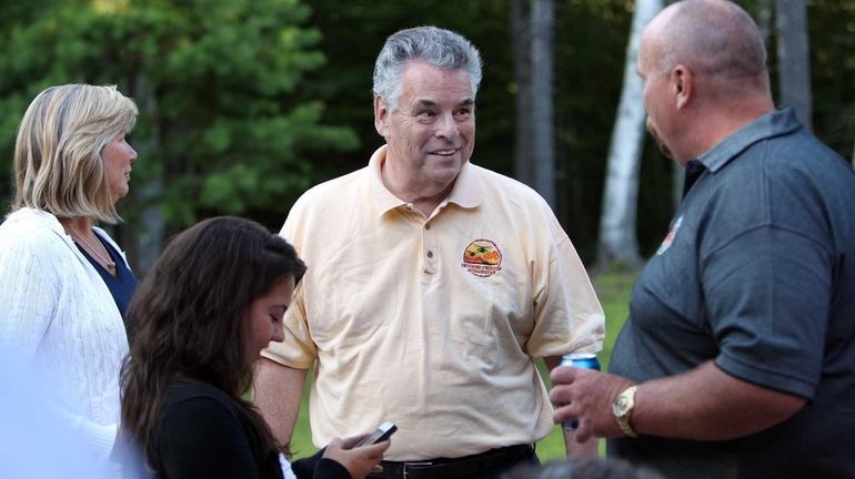 U.S. Rep. Pete King, R-N.Y., center, talks with Don Rowan...