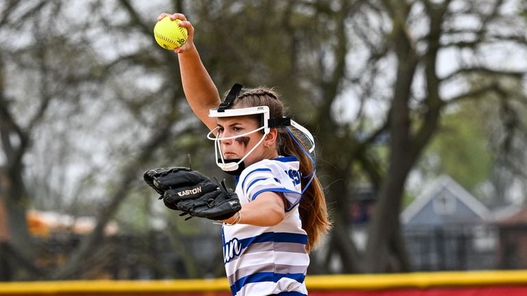 Calhoun starting pitcher Johanna Esposito warms up aon the mound...