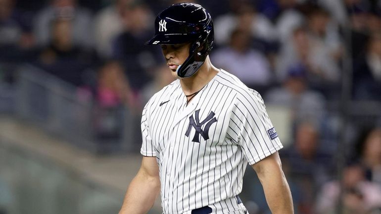 Giancarlo Stanton of the Yankees strikes out during the sixth inning...