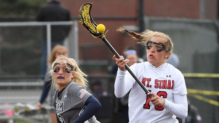 Morgan Mitchell of Mt. Sinai controls the ball to win...