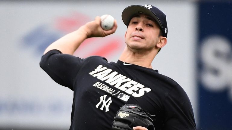New York Yankees pitcher Luis Cessa throws on the field during...
