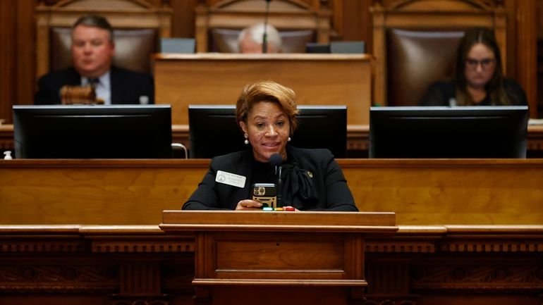 Georgia state Rep. Mesha Mainor, D-Atlanta, center, speaks in the...