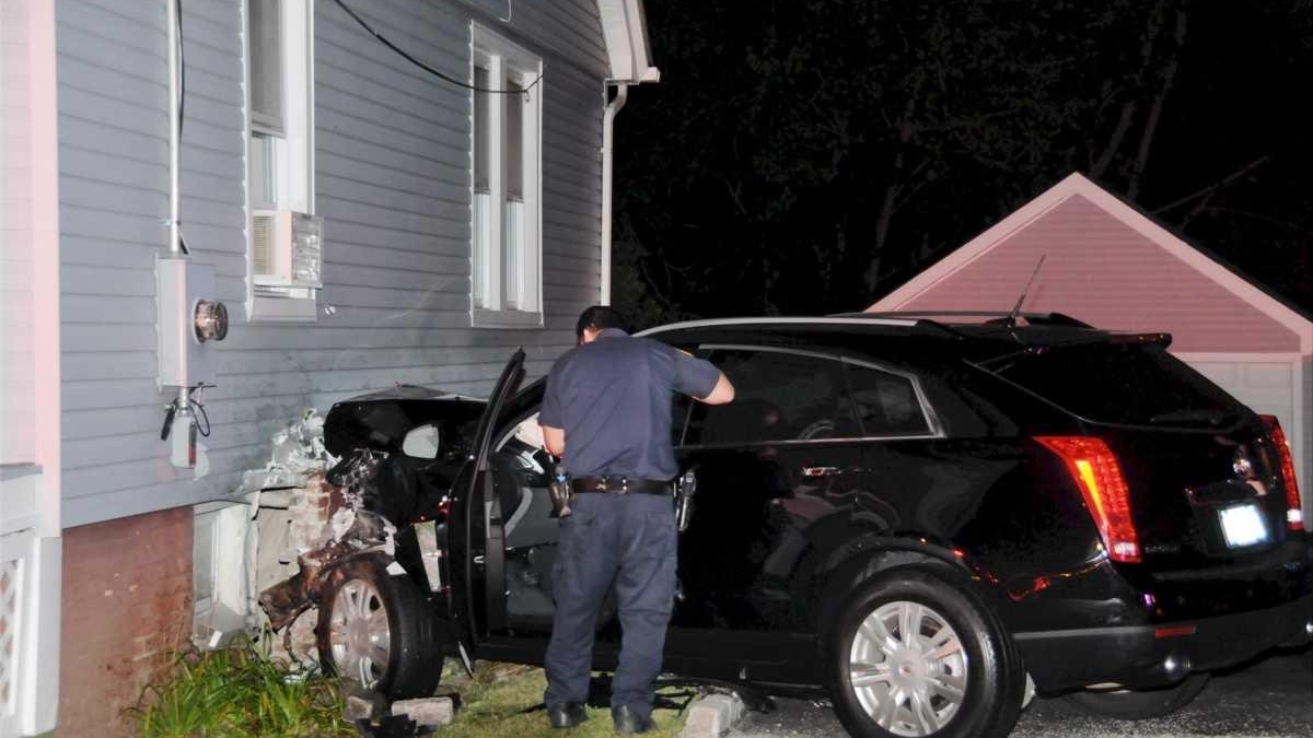 Driver in hospital after car hits house - Newsday