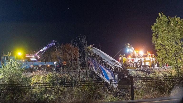 Crews work to remove from a ravine on I-84 in Orange...