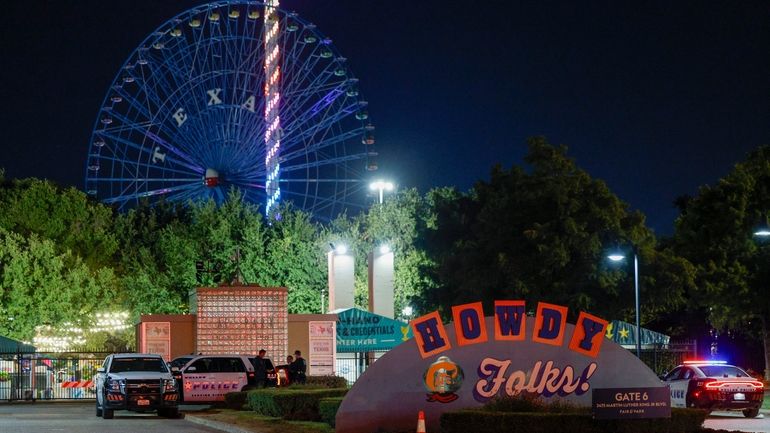 Dallas police block an entrance to the State Fair of...