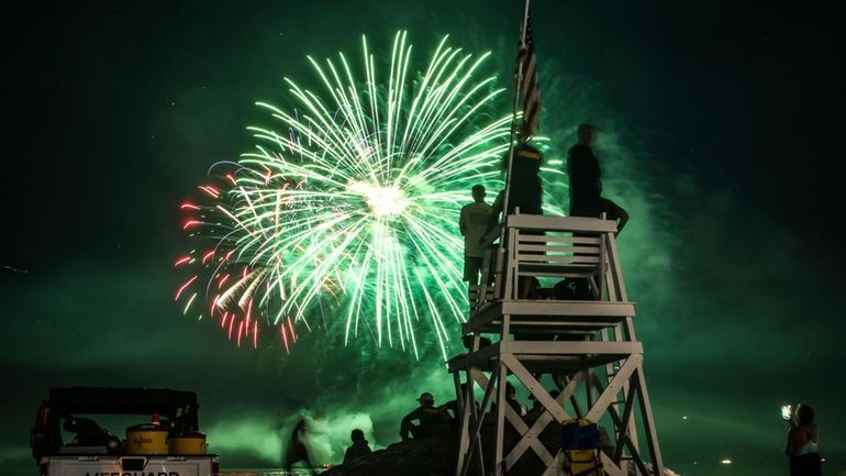 Crowds gather to watch Fourth of July Fireworks explode over...
